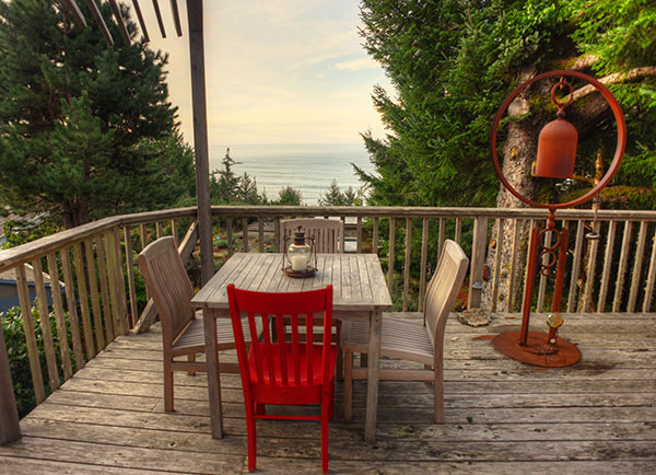 Photo Red Chair on deck overlooking ocean at WildSpring