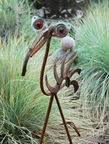 Photo of playful bird sculpture made of metal parts