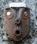 Photo closeup of metal sculpture of face
