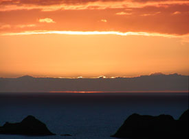 Photo of sunset at ocean horizon